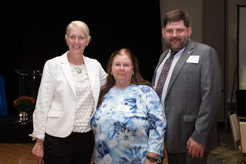 JJ Davis and John Kosky with a 50-year Law School staff member