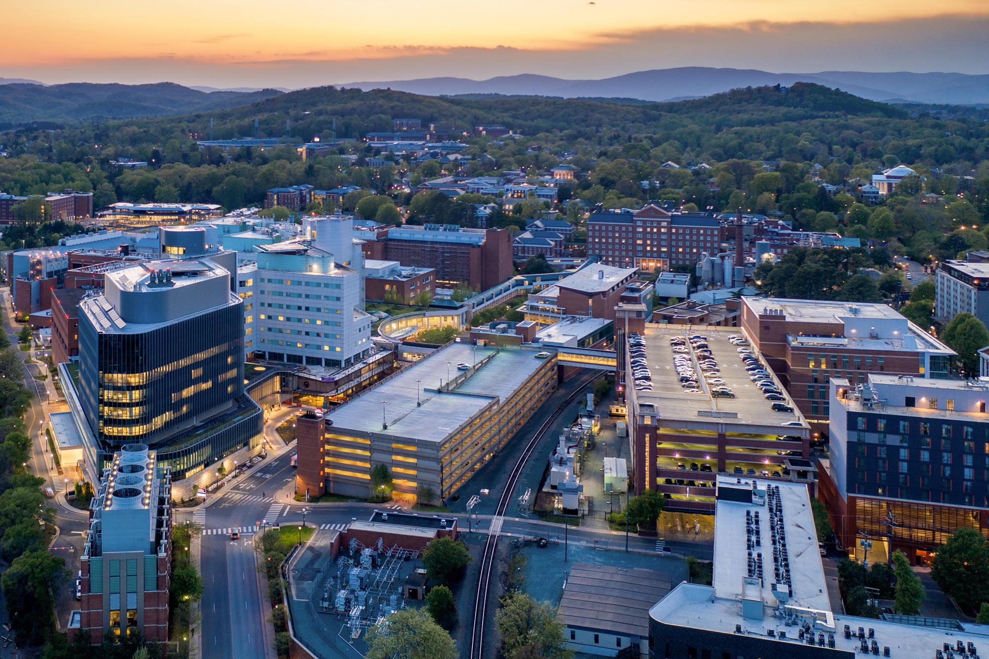 aerial view of Medical Center with Academical Village in background at sunset