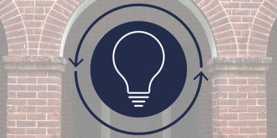 lightbulb with arrows in circle around it; building arches in background